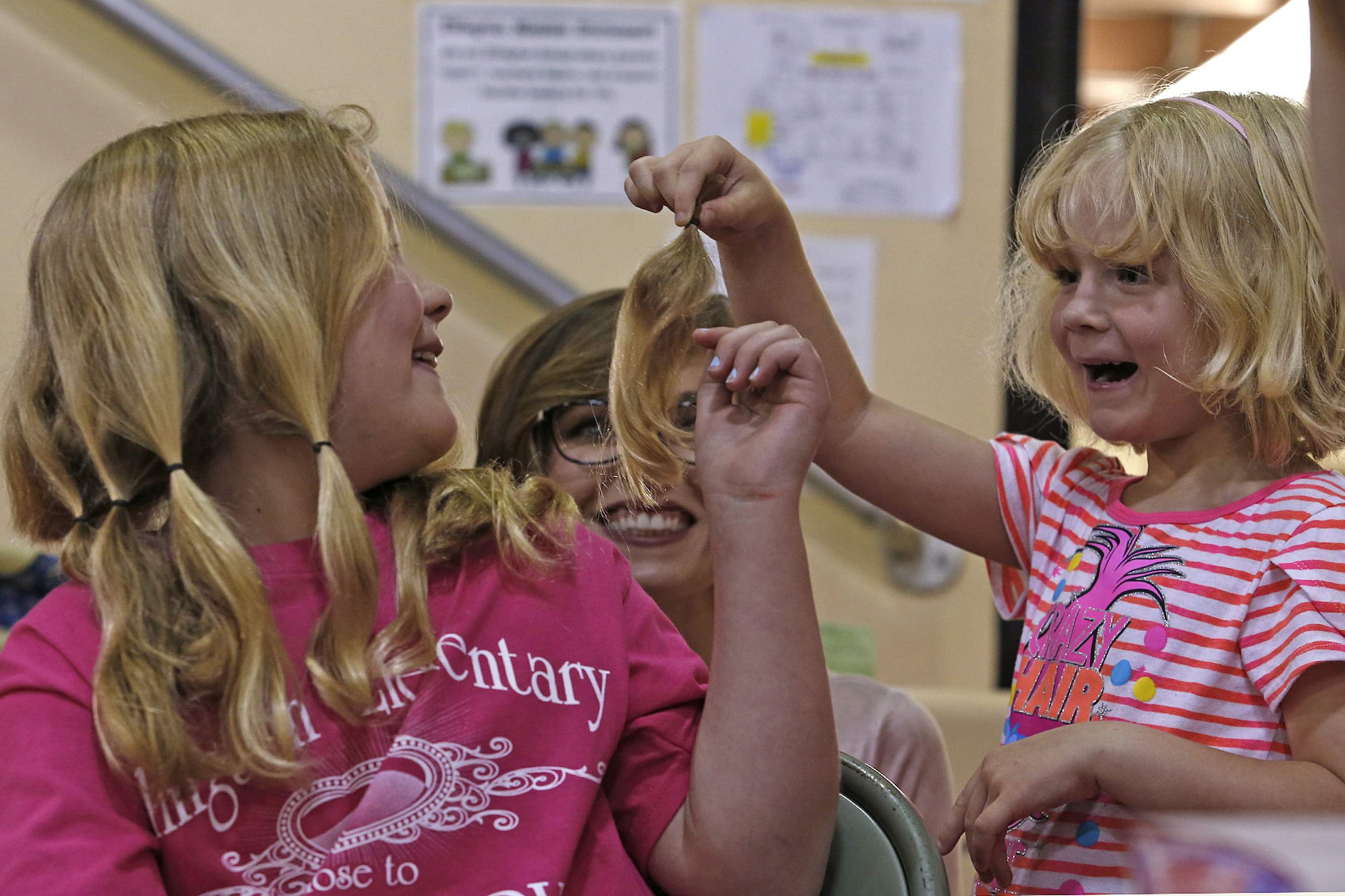 Schools host haircut events to help children with hair loss